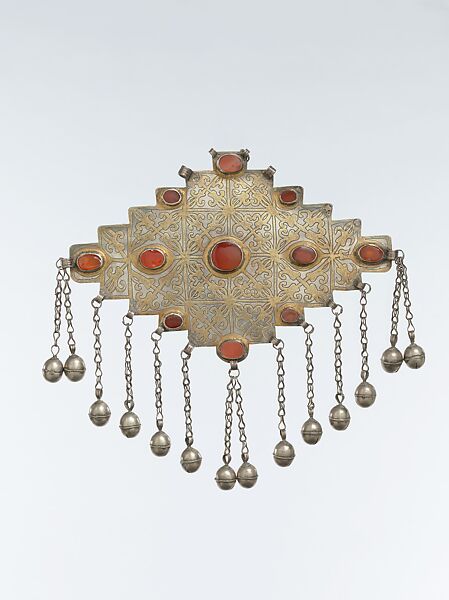 Gul-Shaped Pectoral Ornament, Silver; fire-gilded and engraved/punched decoration with table cut carnelians, silver link chains and spherical bead/bells 