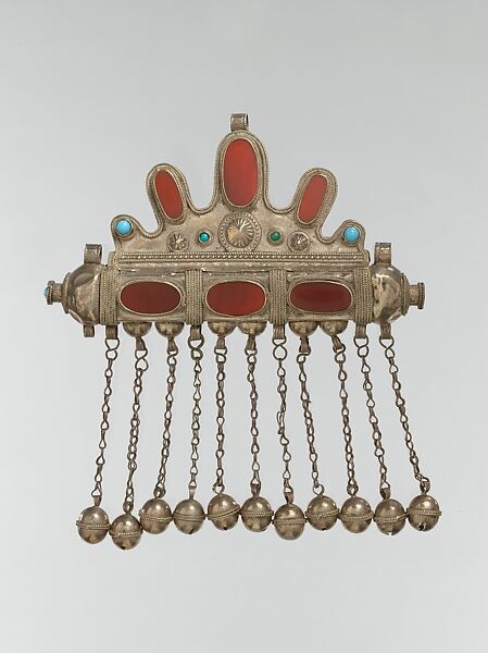Triangular Amulet Holder, Silver with silver twisted wire and applied decoration, slightly domed table cut carnelians and turquoise beads, silver link chains and spherical bells/beads. 