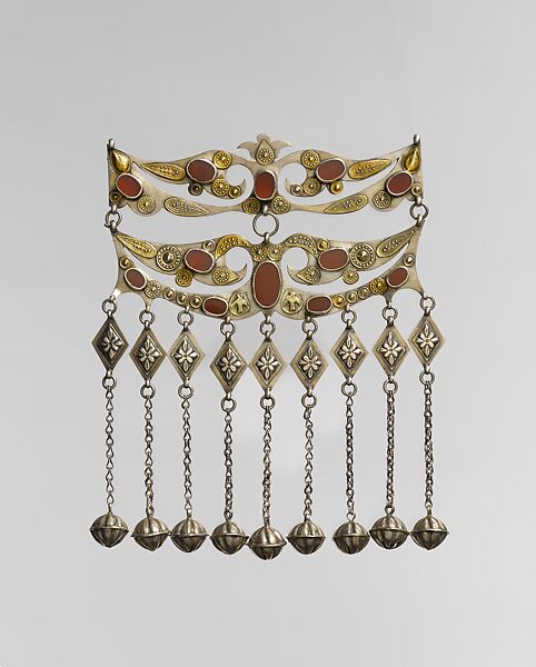 Dorsal Headdress Ornament, Silver with gilt applied decoration, embossed decoration, table cut carnelians, loop-in-loop chains, and bells 