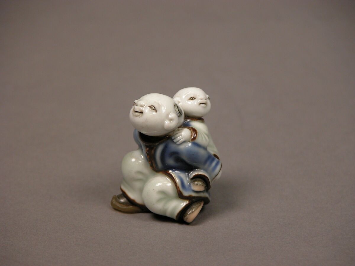 Child Carrying an Infant Netsuke, Porcelain with underglaze blue and overglaze enamels (Hirado ware), Japan 