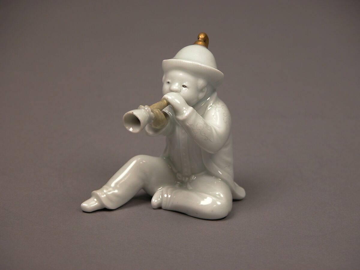 Boy Blowing a Horn, White porcelain with incised decoration and gold (Hirado ware), Japan 