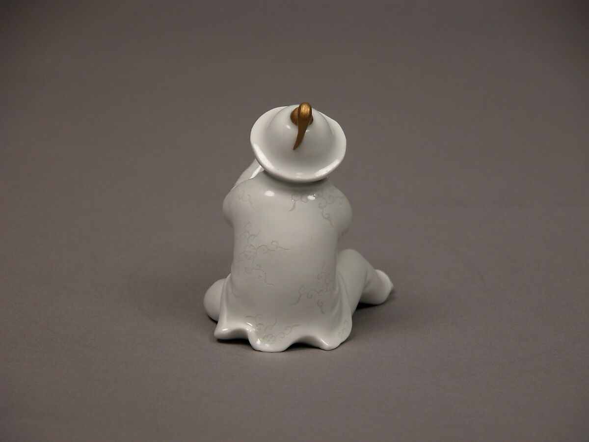 Boy Blowing a Horn, White porcelain with incised decoration and gold (Hirado ware), Japan