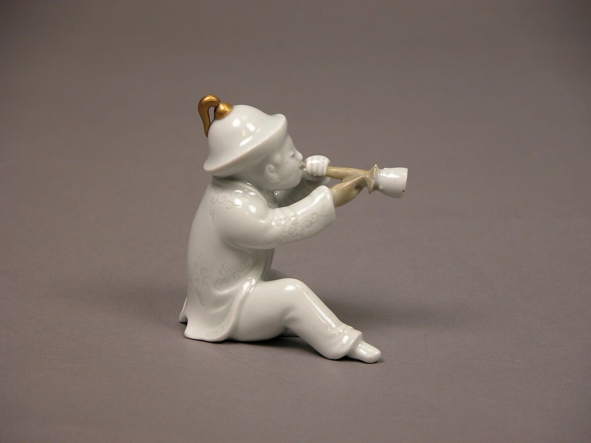 Boy Blowing a Horn, White porcelain with incised decoration and gold (Hirado ware), Japan