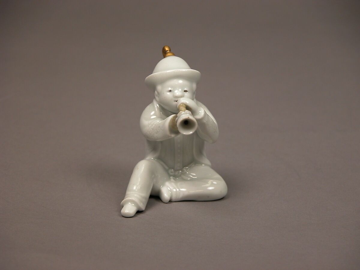 Boy Blowing a Horn, White porcelain with incised decoration and gold (Hirado ware), Japan