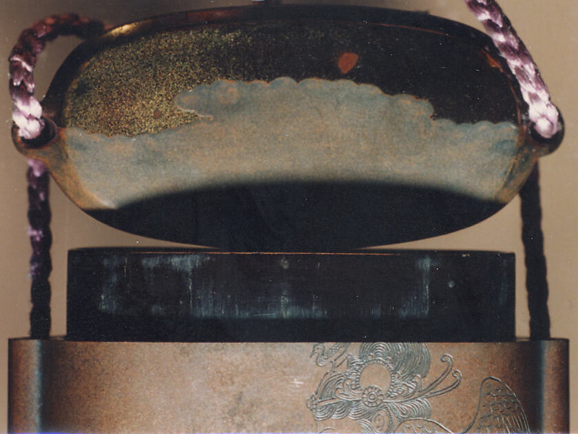Case (Inrō) with Design of Buddhist Angel (obverse); Pine Forest (reverse), Tōyō (Japanese, active second half of the 18th century), Silver shibuichi lacquer decorated with roiro (waxen) lacquer and gold sprinkled and polished hiramakie lacquer; Ojime: coral bead; Netsuke: metal zogan inlay pine tree, Japan