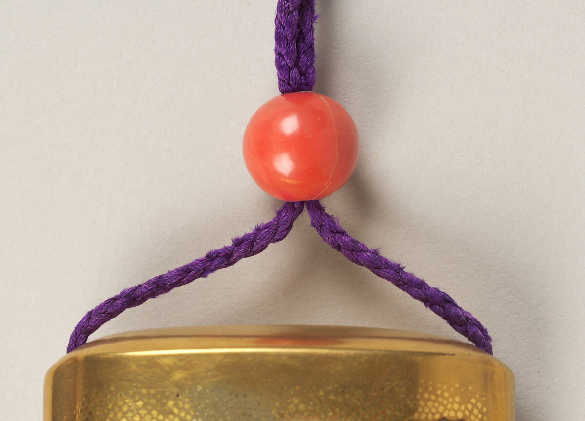 Inrō with Prince Yamato Takeru Disguised as a Woman, Bairin (lacquerwork), Five cases; lacquered wood with gold, silver takamaki-e, hiramaki-e, and cut-out gold foil application on gold ground
Netsuke: kagamibuta type, Ono no Tōfū; ivory and metal
Ojime: red coral bead, Japan