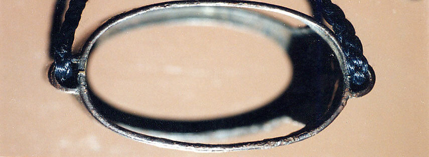 Case (Inrō) with Design of Court Lady in a Boat (obverse); Willow Tree (Asazuma) (reverse), Silver inlay with incised and applied gold decoration 
Ojime: silver bead 
Netsuke: bronze disk with metal inlay, Japan