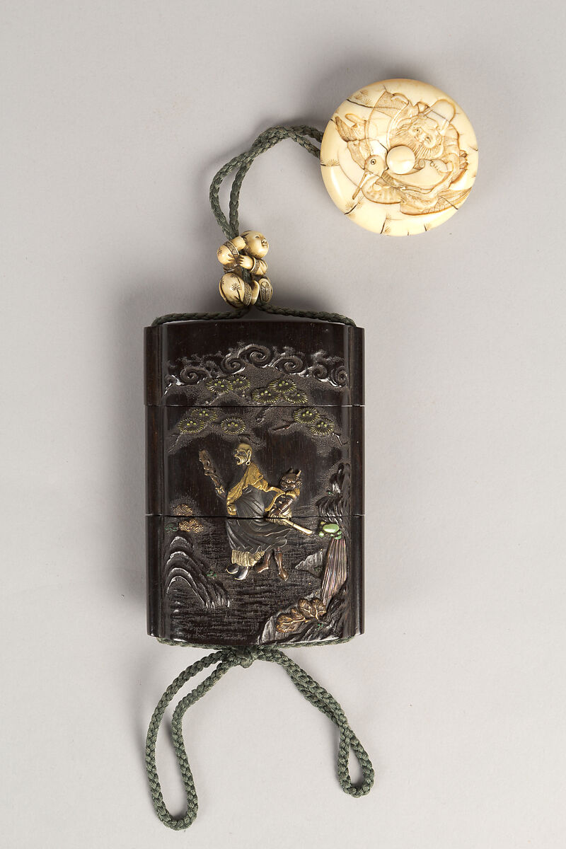 Case (Inrō) with Design of Ōni (Demon) Standing Behind Cloak of Arhat (obverse); Fly Whisk (Hossu) beneath Pine Tree (reverse), Tokoku, Wood ebony, carved relief with inlay of ivory, metal and malachite; Interior: plain;  Netsuke: Jurojin on crane; Ojime: Child climbing rope, Japan 