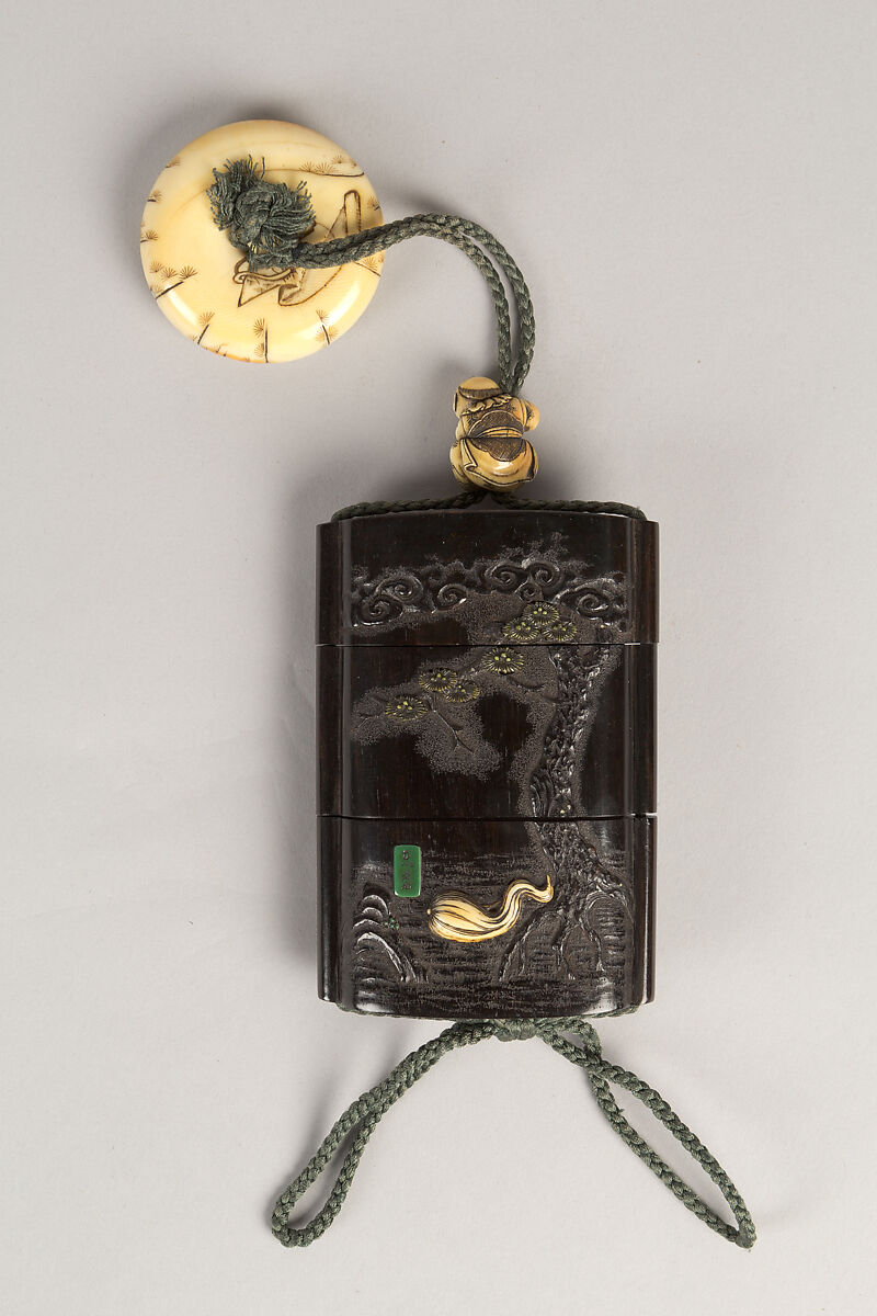 Case (Inrō) with Design of Ōni (Demon) Standing Behind Cloak of Arhat (obverse); Fly Whisk (Hossu) beneath Pine Tree (reverse), Tokoku, Wood ebony, carved relief with inlay of ivory, metal and malachite; Interior: plain;  Netsuke: Jurojin on crane; Ojime: Child climbing rope, Japan