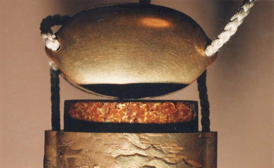 Case (Inrō) with Design of Momotarō and Dog on the way to the Island of the Devils (obverse); Monkey with Pheasant (reverse), Kogyoku Tokayo, Lacquer with sprinkled, polished, and relief makie gold and silver, metal inlay; Interior: gyobu nashiji and fundame; Netsuke: Eight masks, Japan