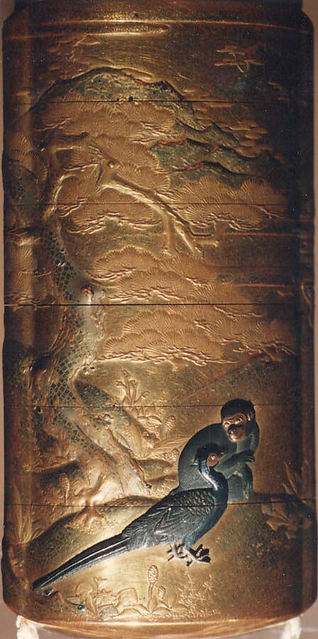 Case (Inrō) with Design of Momotarō and Dog on the way to the Island of the Devils (obverse); Monkey with Pheasant (reverse), Kogyoku Tokayo, Lacquer with sprinkled, polished, and relief makie gold and silver, metal inlay; Interior: gyobu nashiji and fundame; Netsuke: Eight masks, Japan