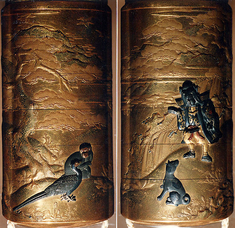Case (Inrō) with Design of Momotarō and Dog on the way to the Island of the Devils (obverse); Monkey with Pheasant (reverse), Kogyoku Tokayo, Lacquer with sprinkled, polished, and relief makie gold and silver, metal inlay; Interior: gyobu nashiji and fundame; Netsuke: Eight masks, Japan 