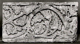 Fragment of a Frieze with Vine Scrolls Bearing Grapes, Limestone; carved in relief