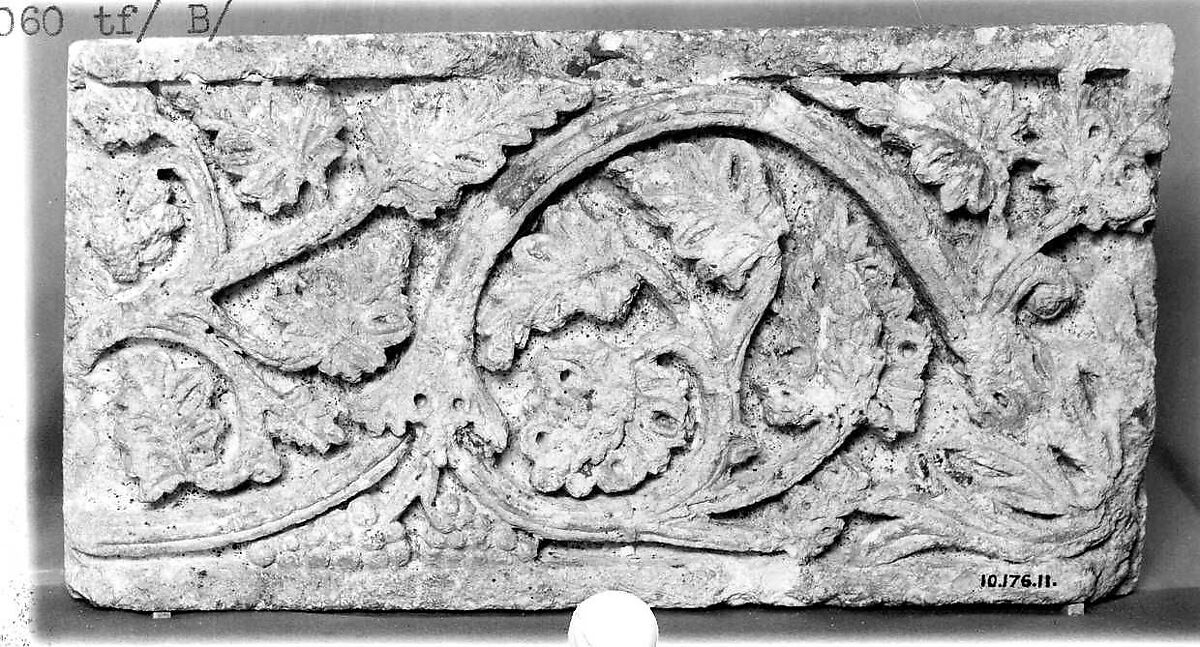 Fragment of a Frieze with Vine Scrolls Bearing Grapes, Limestone; carved in relief 