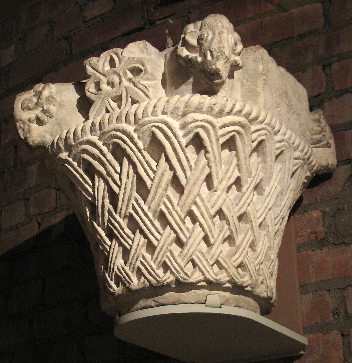 Capital with a Basket-Weave Pattern and Rams’ Heads, Limestone; carved in relief 