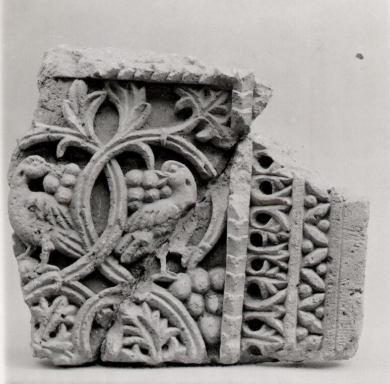 Fragment from a Two-Sided Sanctuary Screen with Birds Eating Grapes, Limestone, red pigment; carved in relief