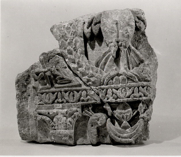 Fragment from a Two-Sided Sanctuary Screen with Birds Eating Grapes, Limestone, red pigment; carved in relief