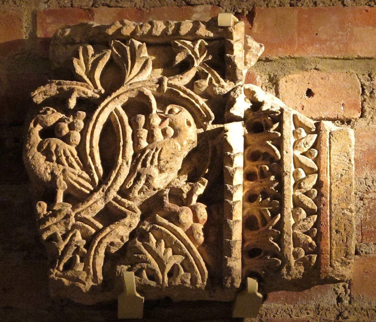 Fragment from a Two-Sided Sanctuary Screen with Birds Eating Grapes, Limestone, red pigment; carved in relief