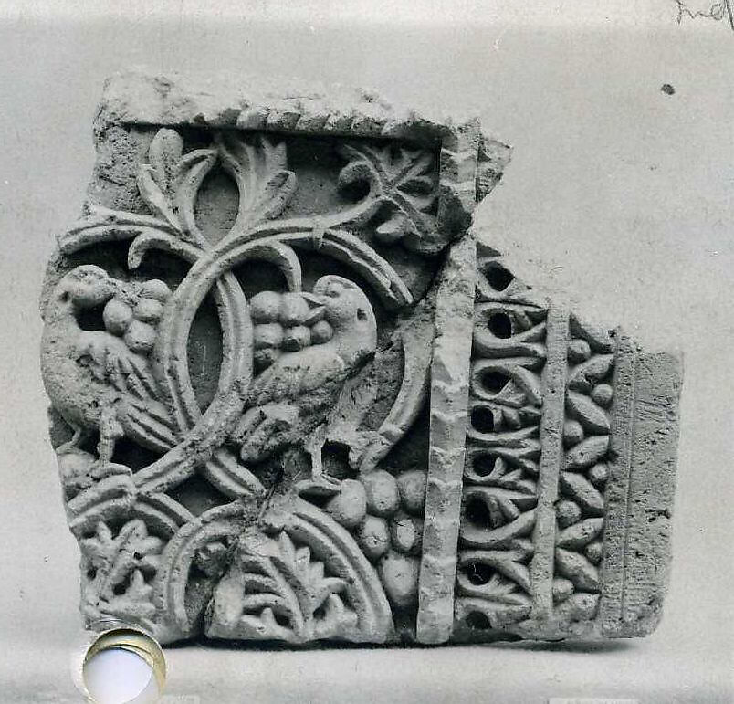 Fragment from a Two-Sided Sanctuary Screen with Birds Eating Grapes, Limestone, red pigment; carved in relief