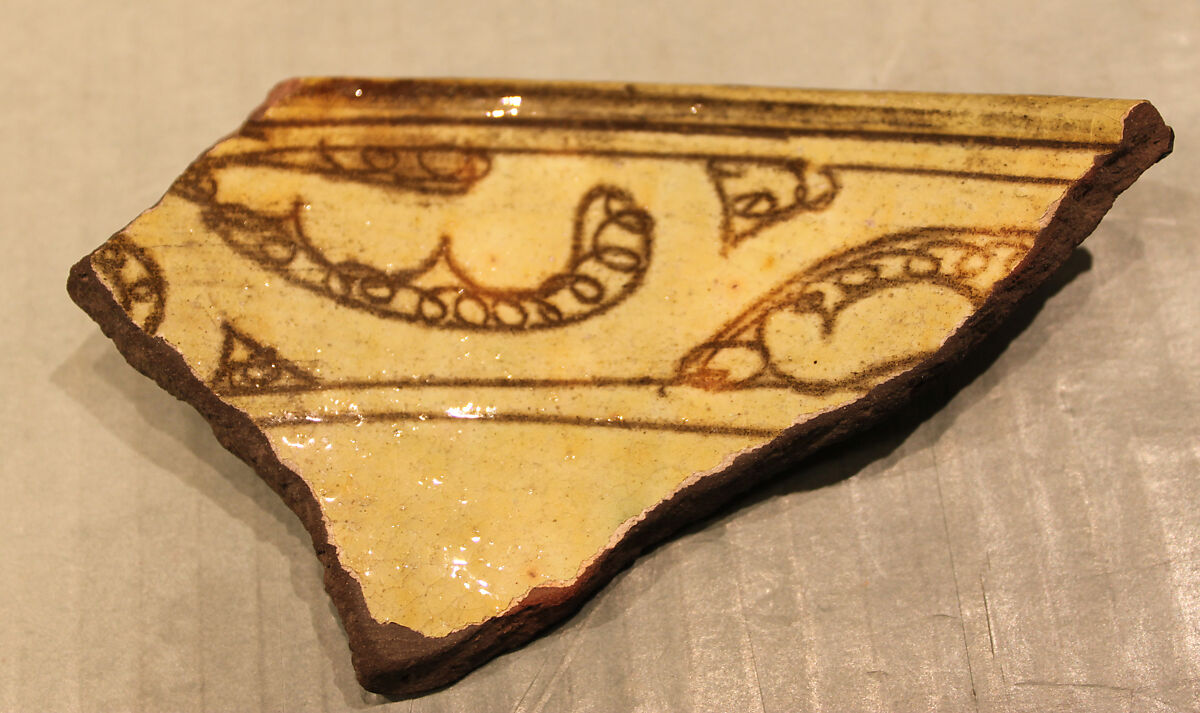 Fragment, Earthenware; incised decoration through a white slip and coloring under transparent glaze 