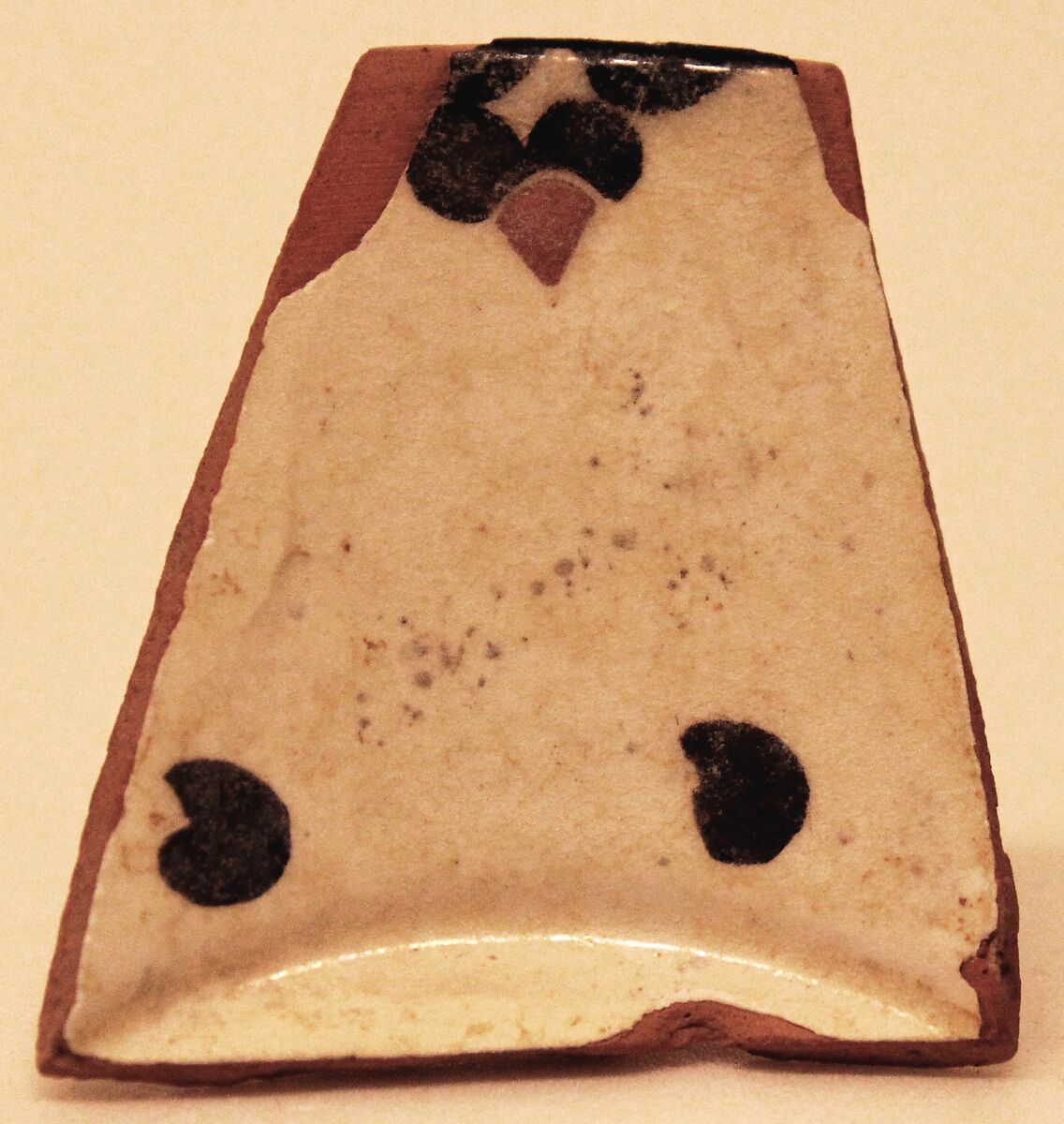 Ceramic Fragment, Earthenware; white slip, painted in black and red 