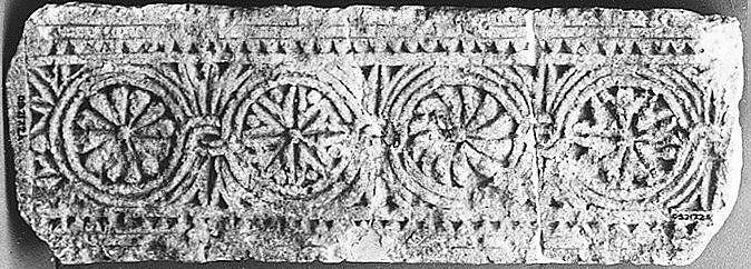 Fragment of a Frieze with Medallions, Limestone; carved