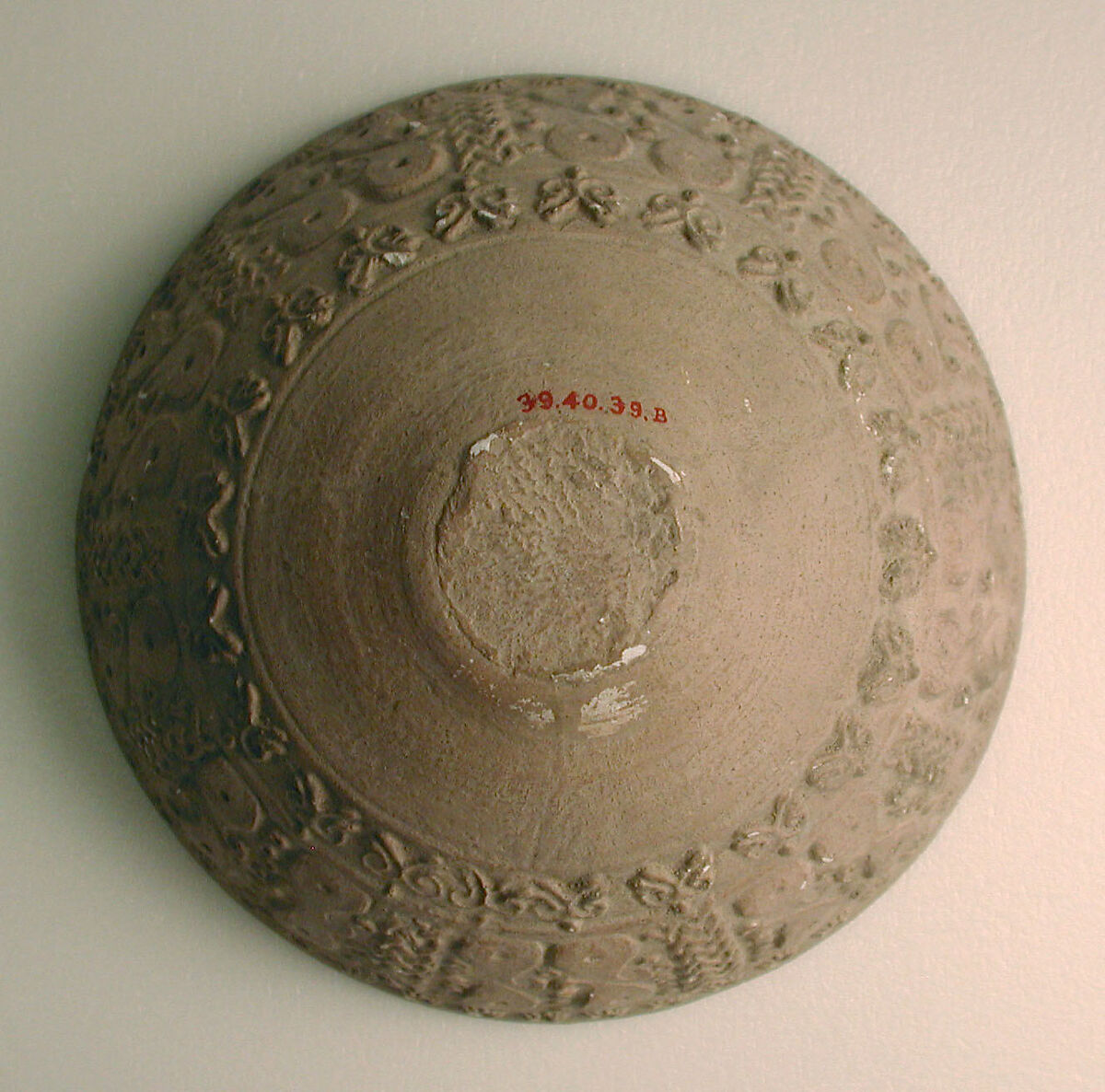 Cast from a Mold, Earthenware; molded and incised decoration, unglazed