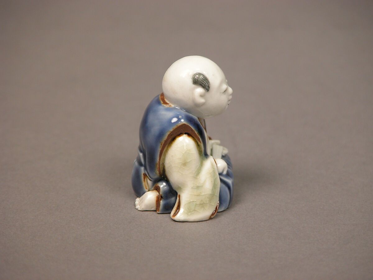 Chinese child with musical instrument, Porcelain with underglaze blue and iron decoration (Hirado ware), Japan