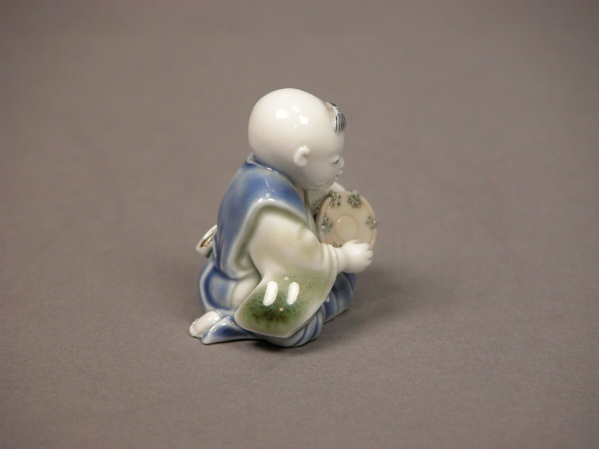Chinese child with musical instrument, Porcelain with underglaze blue and iron decoration (Hirado ware), Japan