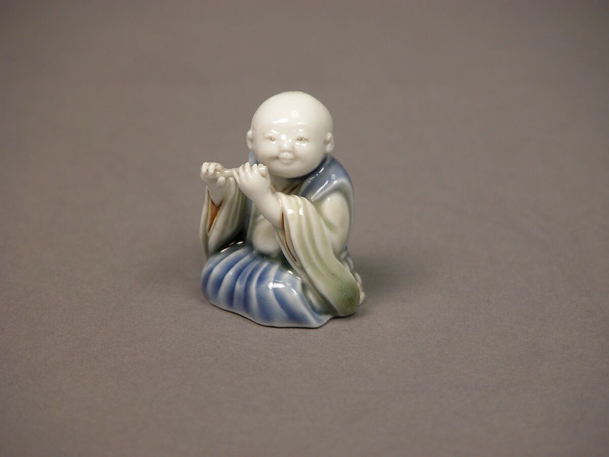 Chinese child with musical instrument, Porcelain with underglaze blue and iron decoration (Hirado ware), Japan
