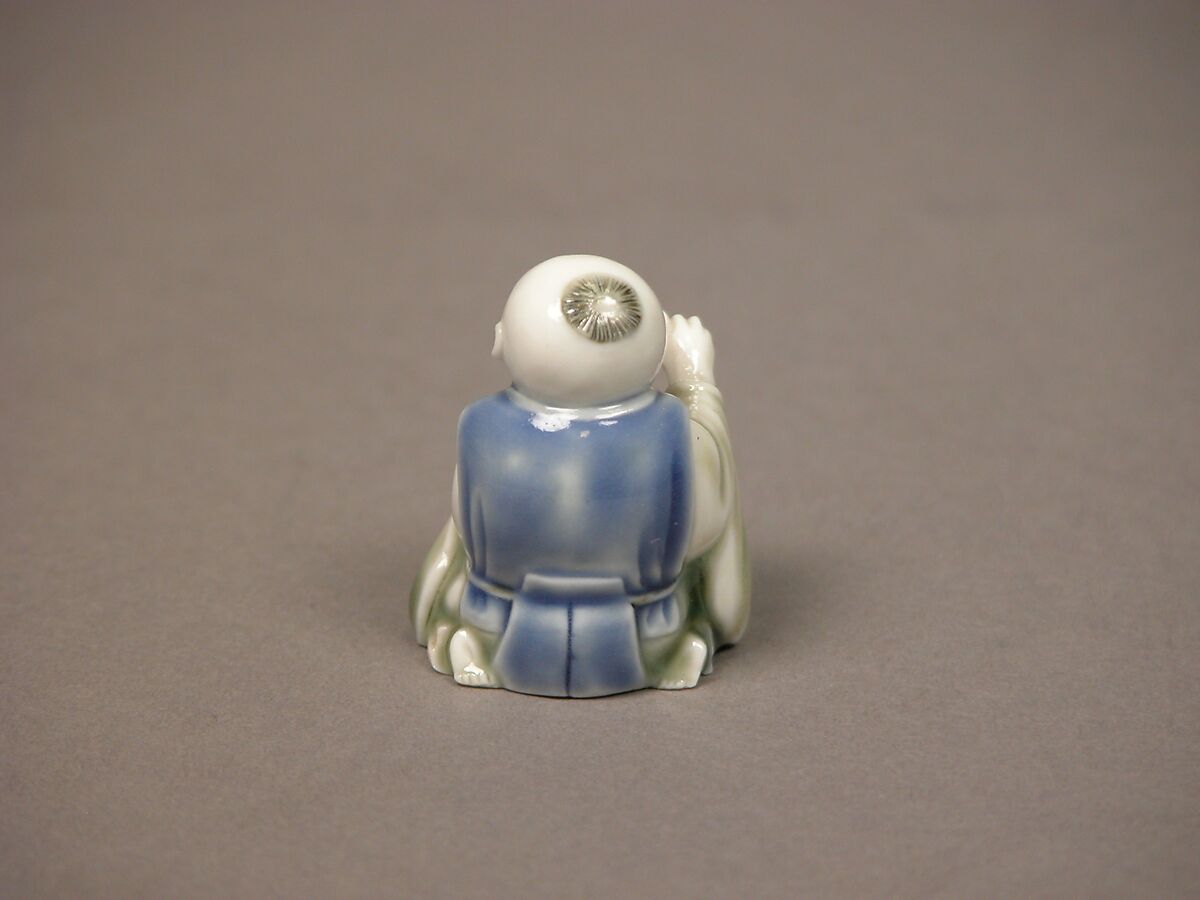 Chinese child with musical instrument, Porcelain with underglaze blue and iron decoration (Hirado ware), Japan