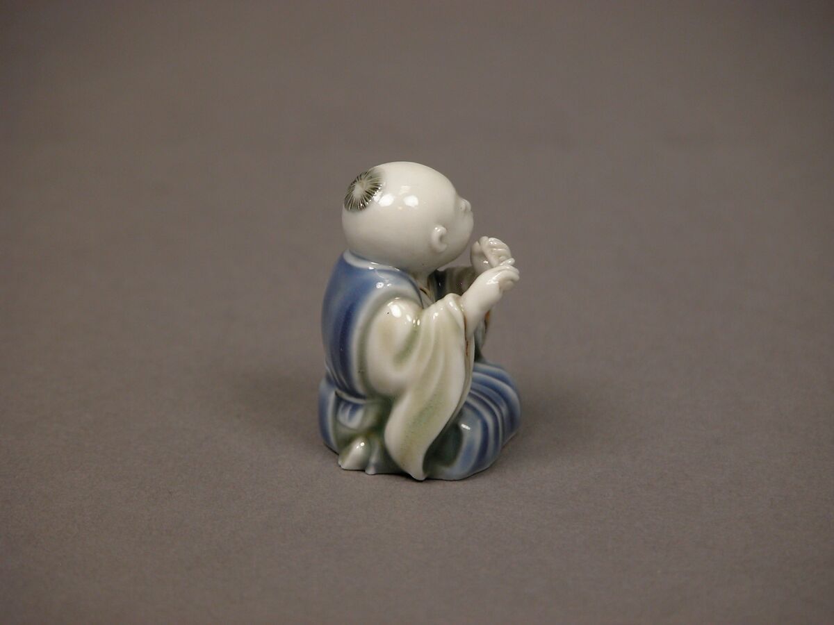 Chinese child with musical instrument, Porcelain with underglaze blue and iron decoration (Hirado ware), Japan