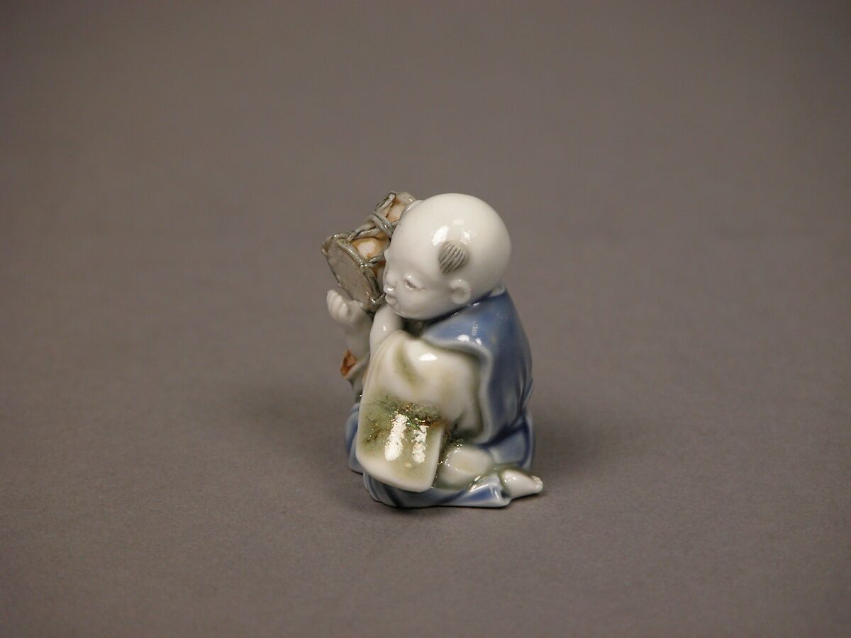 Chinese child with musical instrument, Porcelain with underglaze blue and iron decoration (Hirado ware), Japan