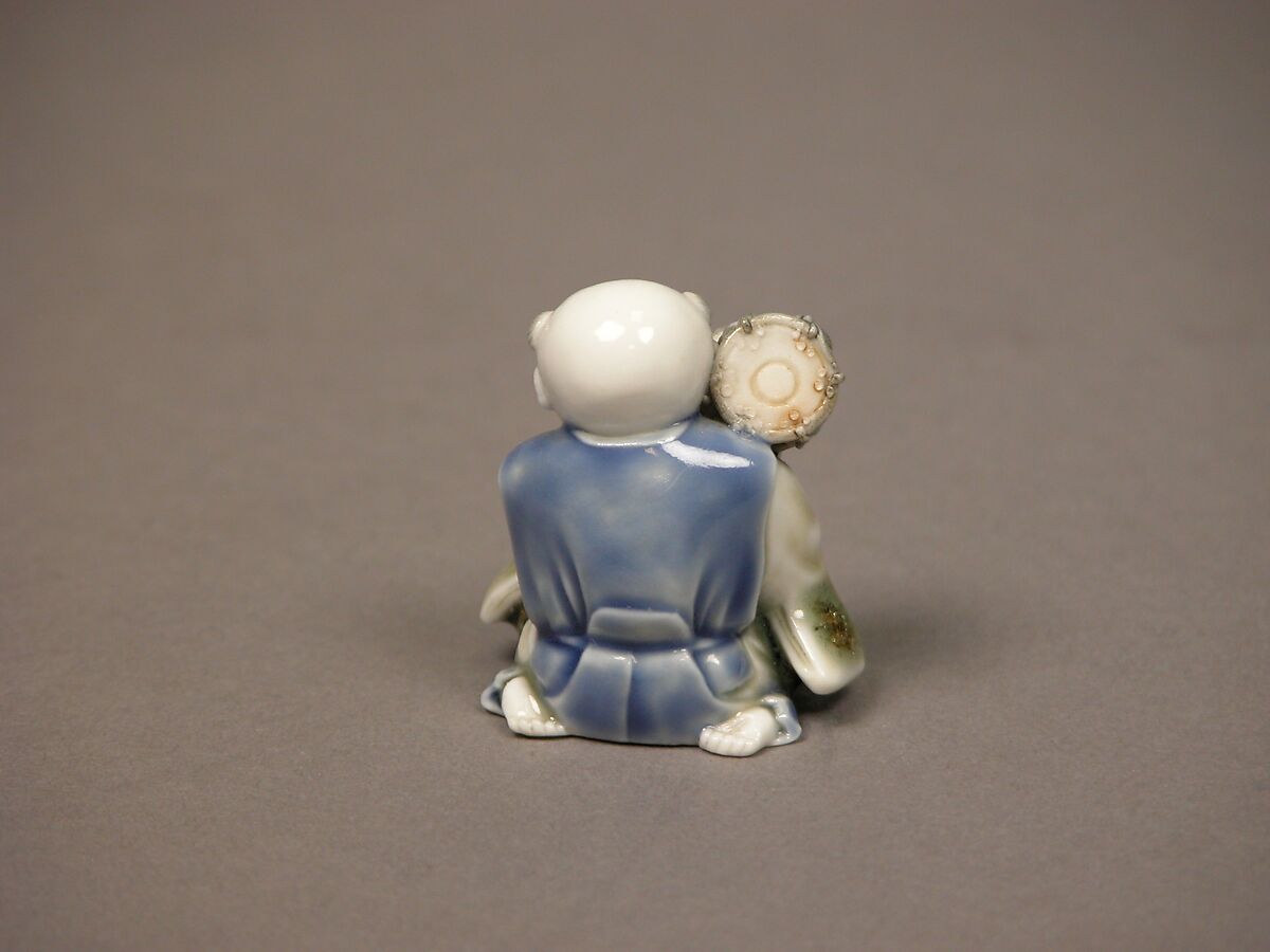 Chinese child with musical instrument, Porcelain with underglaze blue and iron decoration (Hirado ware), Japan