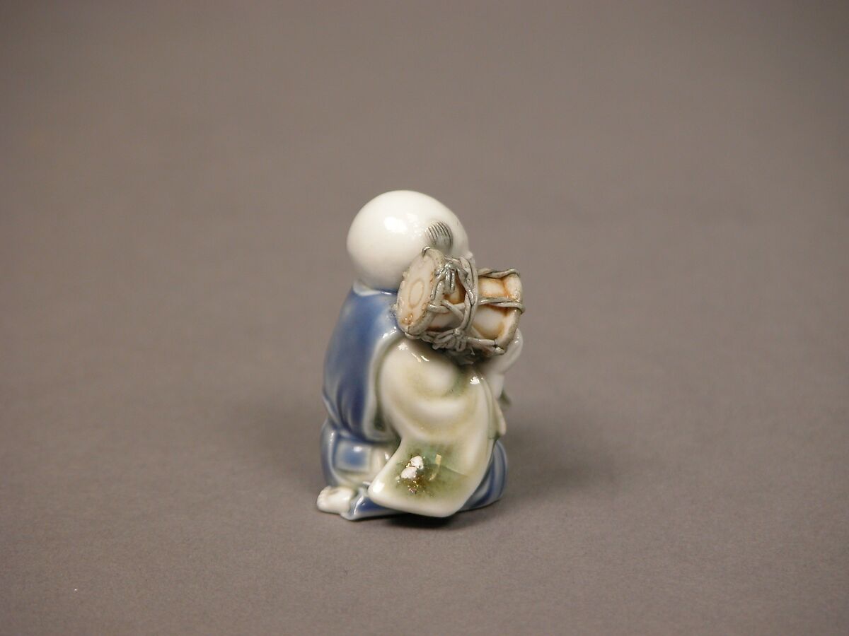 Chinese child with musical instrument, Porcelain with underglaze blue and iron decoration (Hirado ware), Japan