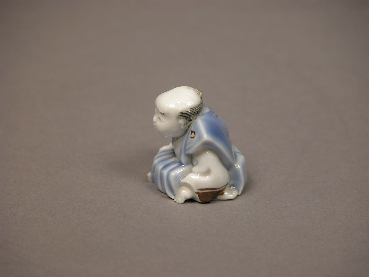 Chinese child with musical instrument, Porcelain with underglaze blue and iron decoration (Hirado ware), Japan