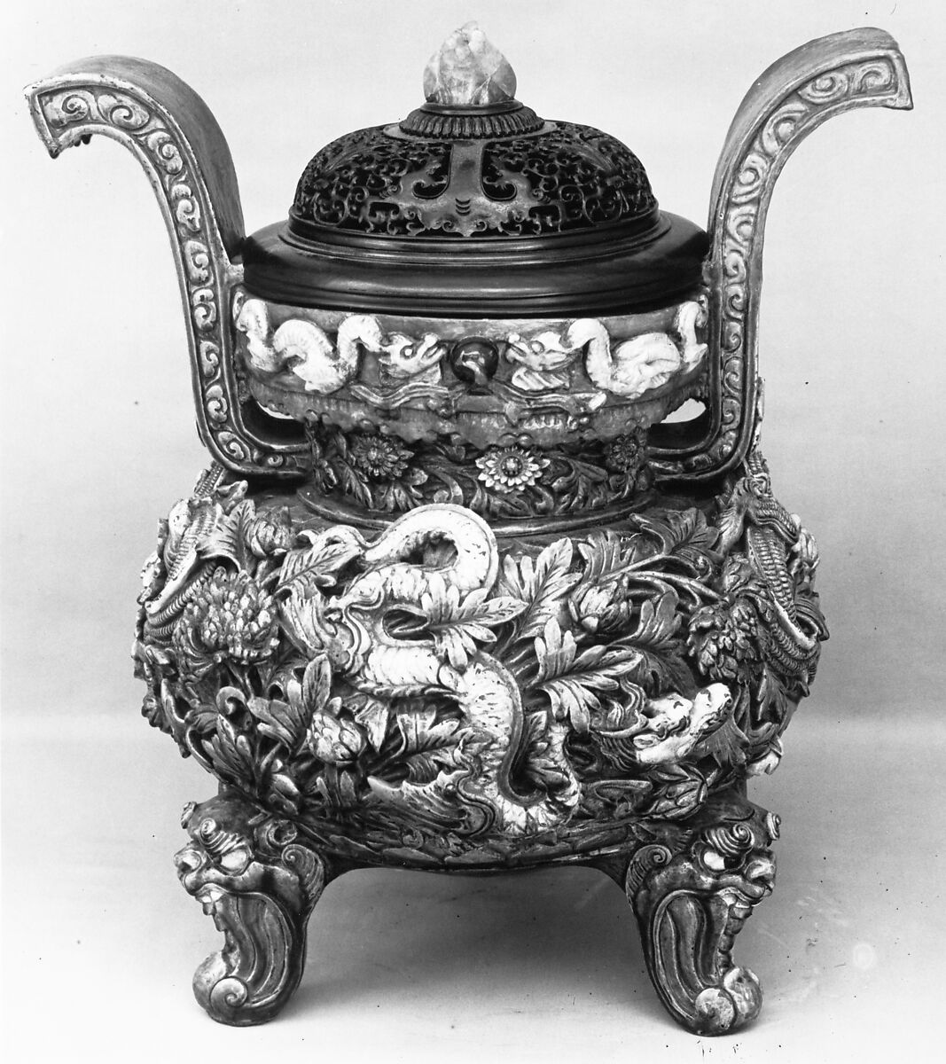 Tripod incense burner with dragon amid flowers, Stoneware with yellow and green glaze over relief decoration (Shanxi liuli ware), China 