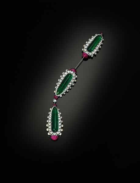 Jabot or Cliquet Brooch, JAR, Silver and gold, set with emeralds, diamonds, pearls, and rubies 