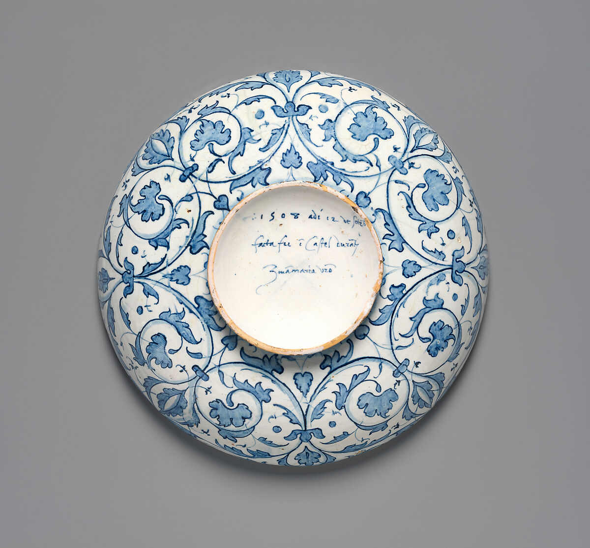 Bowl with the Arms of Pope Julius II and the Manzoli of Bologna surrounded by putti, cornucopiae, satyrs, dolphins, birds, etc., workshop of Giovanni Maria Vasaro (Italian (Castel Durante), active early 16th century), Maiolica (tin-glazed earthenware), Italian, Castel Durante