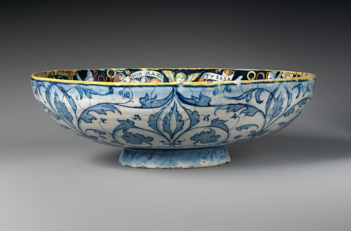 Bowl with the Arms of Pope Julius II and the Manzoli of Bologna surrounded by putti, cornucopiae, satyrs, dolphins, birds, etc., workshop of Giovanni Maria Vasaro (Italian (Castel Durante), active early 16th century), Maiolica (tin-glazed earthenware), Italian, Castel Durante