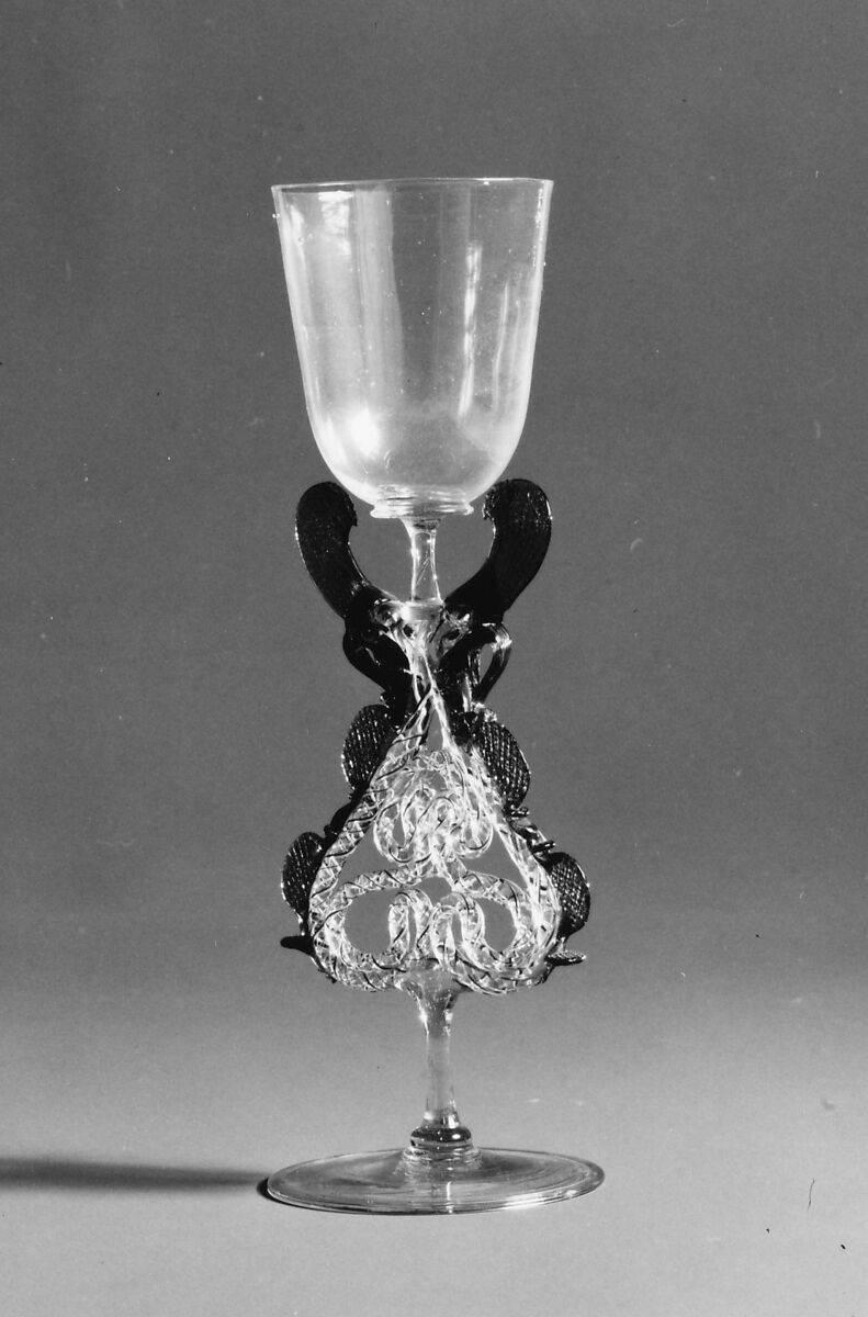 Goblet, Colorless (yellowish), transparent turquoise blue, and opaque brick red, yellow, and white nonlead glass.  Blown, trailed, pincered, "vetro a retorti"., Façon de Venise, probably south Lowlands or Germany