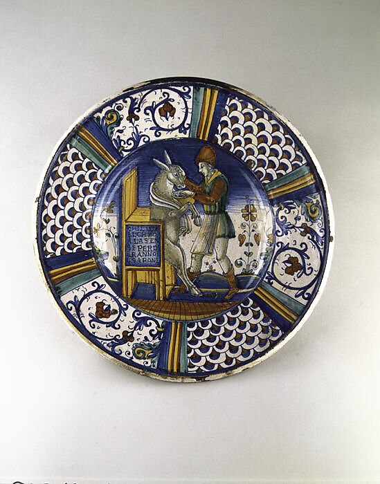 Dish (piatto): Man Washing the Mouth of an Ass, Maiolica (tin-glazed earthenware), Italian, Deruta