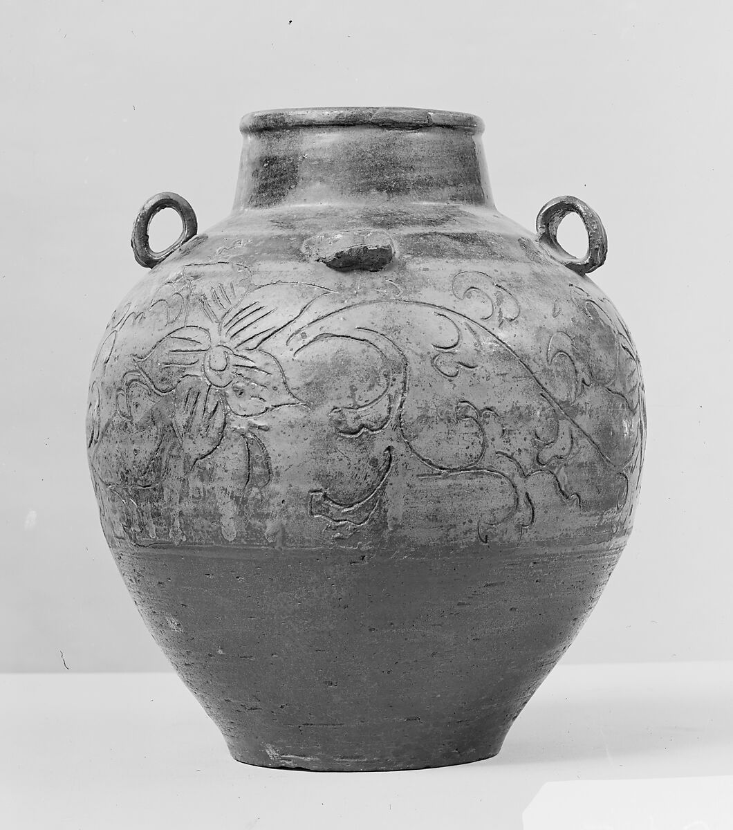 Jar, Clay covered with a transparent glaze with streaks on the upper half, a thin brown glaze on the lower half; incised decorations (Karatsu ware), Japan 