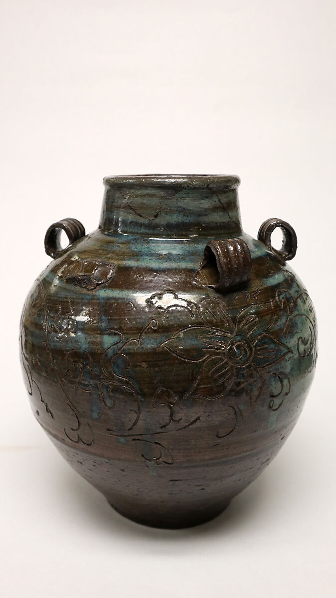 Jar, Clay covered with a transparent glaze with streaks on the upper half, a thin brown glaze on the lower half; incised decorations (Karatsu ware), Japan