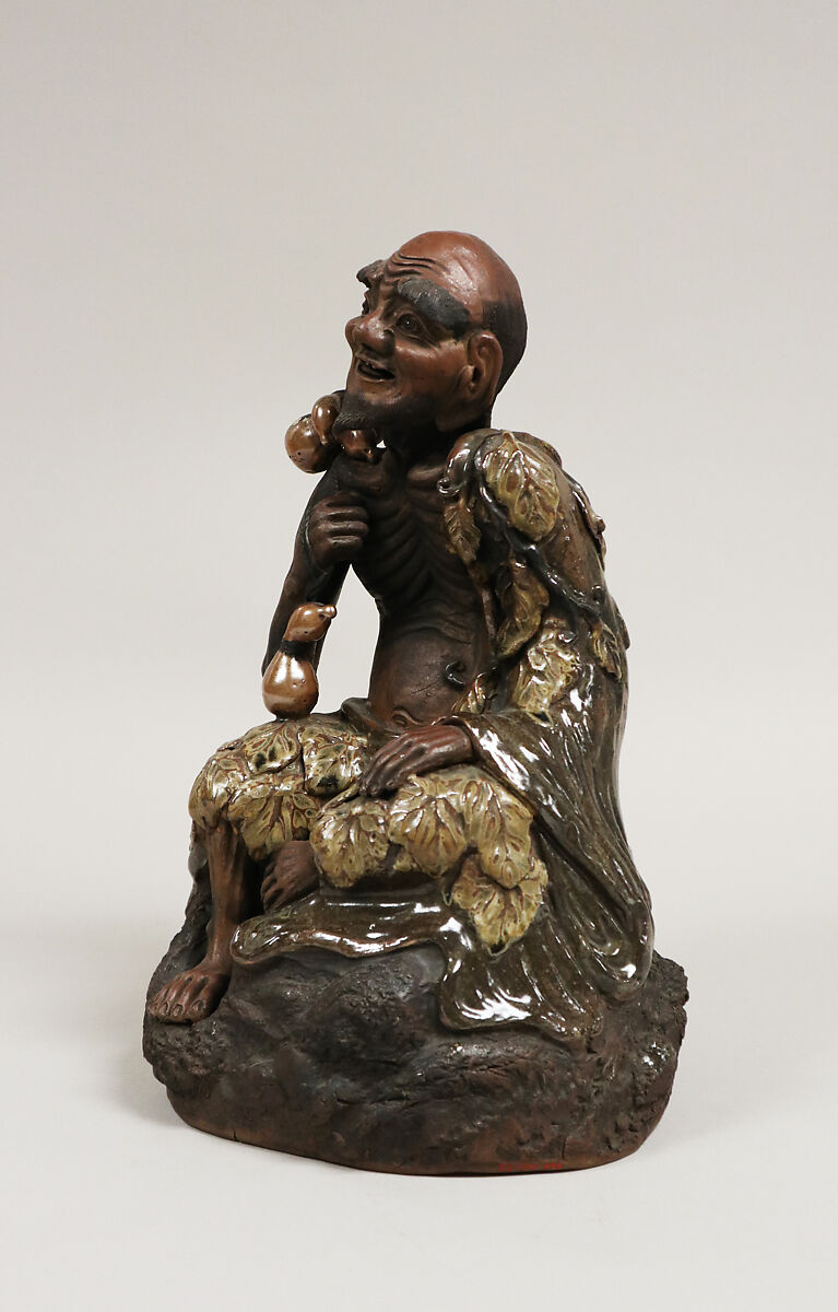 Sennin, Pottery, partly unglazed; the costume in reddish brown glaze (Takatori ware), Japan