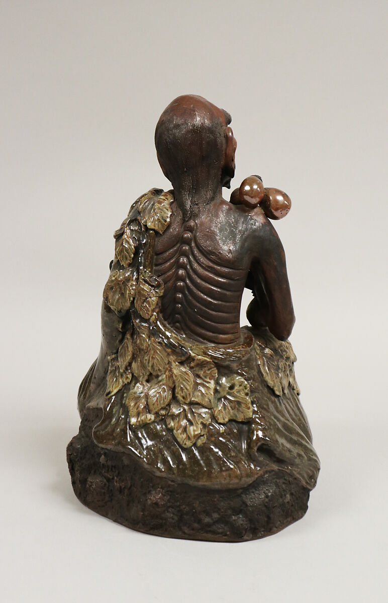 Sennin, Pottery, partly unglazed; the costume in reddish brown glaze (Takatori ware), Japan