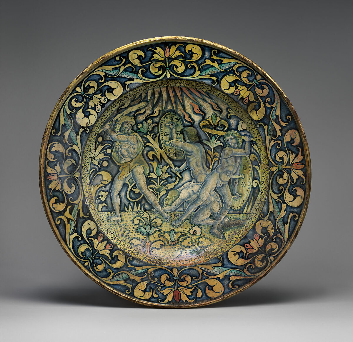 Dish (piatto); The story of Hercules: the gods called upon Hercules to help them defend Olympus against the attack of the Giants, sons of Uranus and Gaea (Heaven and Earth), Maiolica (tin-glazed earthenware), Italian, Deruta 