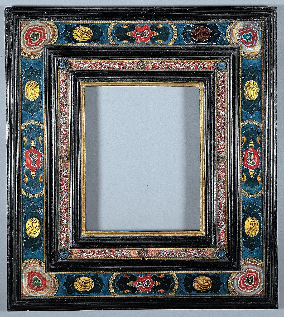 Cassetta frame, Poplar back frame with applied ebonized pearwood upper moldings; glass. Half-lapped back frame. Sight edge: oil gilt. Friezes: verre églomisé, or reverse-painted glass, held in with bronze-colored ripple moldings and gilt-bronze panel ends, and painted to resemble stone mosaic., Italian, Rome 