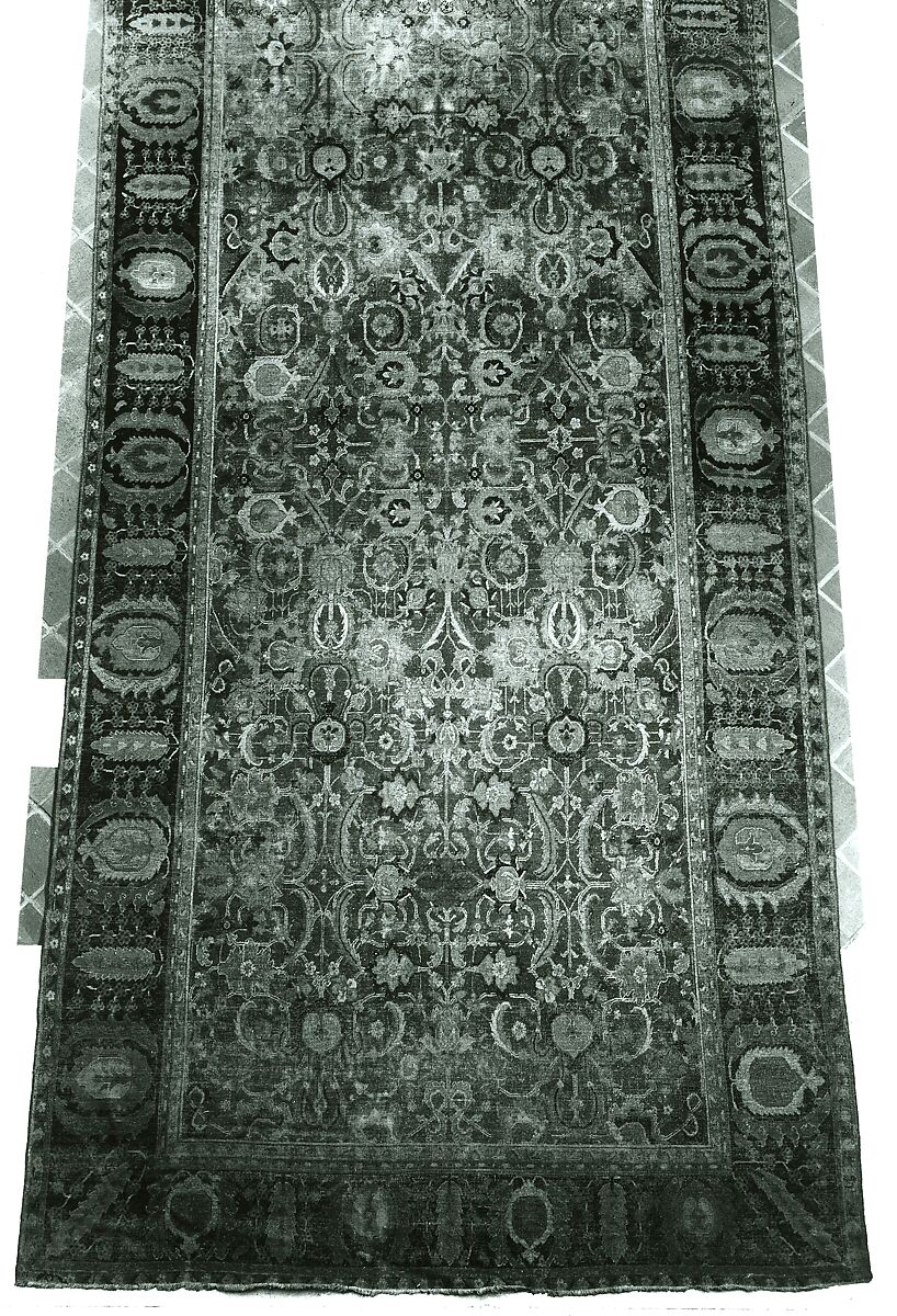 Indo-Persian carpet with repeat pattern of vine scrolls and palmettes, Wool pile on cotton foundation., Indo-Persian