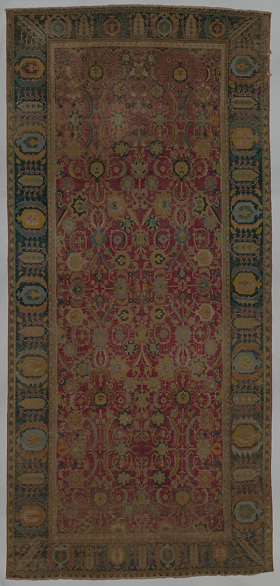 Indo-Persian carpet with repeat pattern of vine scrolls and palmettes, Wool pile on cotton foundation., Indo-Persian 